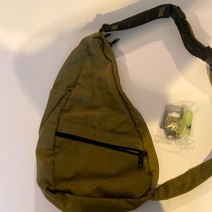 Outdoor side satchel bag with keychain.